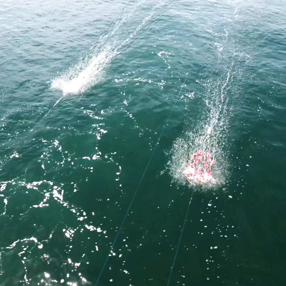Spreader bars being trolled behind boat